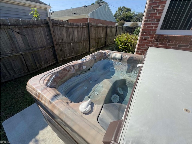 exterior space with a hot tub