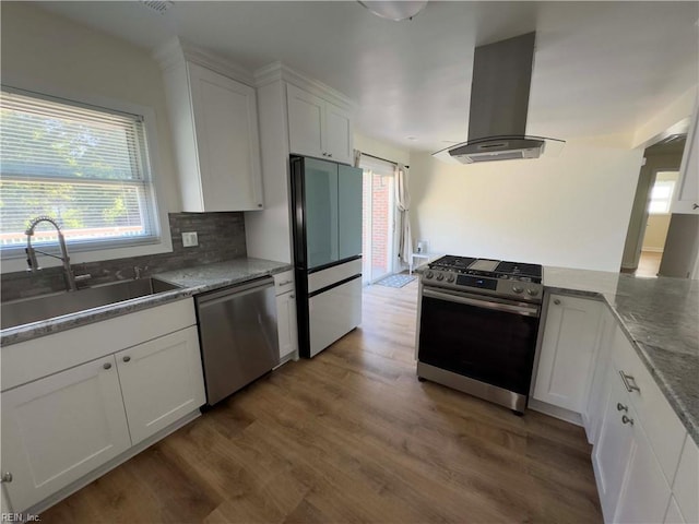 kitchen featuring sink, island exhaust hood, white cabinetry, stainless steel appliances, and dark hardwood / wood-style flooring