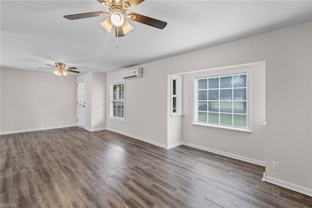 interior space with an AC wall unit, ceiling fan, and dark wood-type flooring