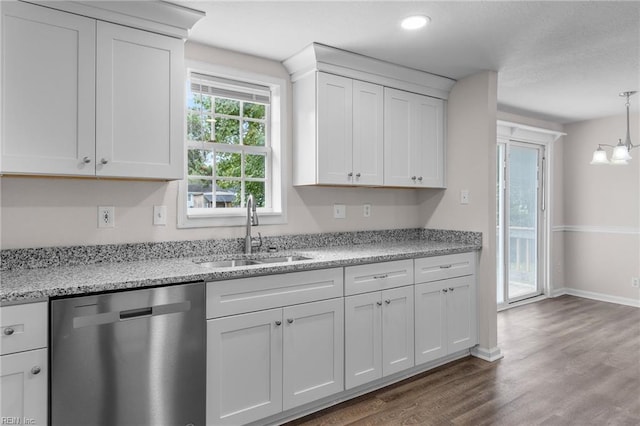 kitchen with pendant lighting, dishwasher, sink, white cabinetry, and dark hardwood / wood-style flooring