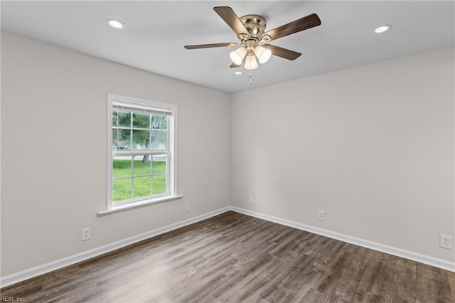 empty room featuring dark hardwood / wood-style floors and ceiling fan