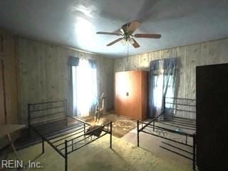 unfurnished bedroom with concrete flooring