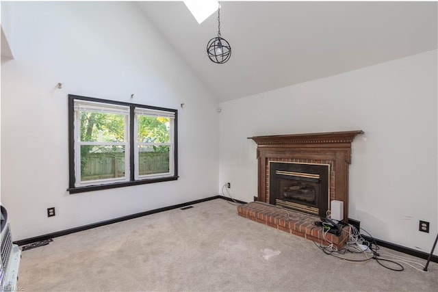 unfurnished living room featuring light colored carpet, a fireplace, and high vaulted ceiling