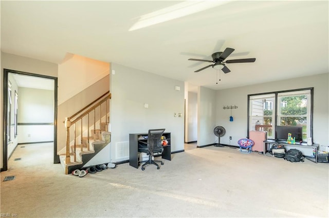 misc room featuring ceiling fan and light colored carpet