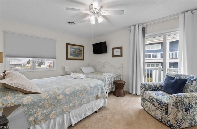 bedroom with light carpet and ceiling fan