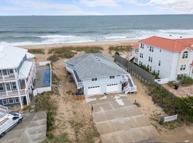 aerial view featuring a water view and a beach view