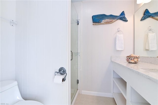 bathroom with a shower with shower door, vanity, and toilet