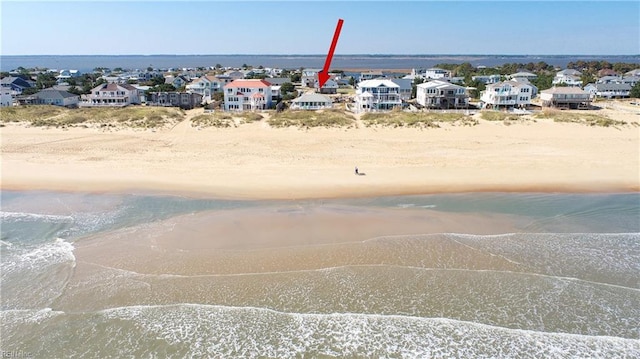 drone / aerial view with a view of the beach and a water view