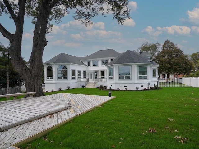 back of house featuring a lawn