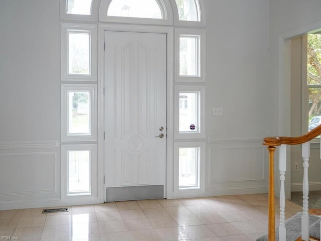 foyer with light tile patterned floors