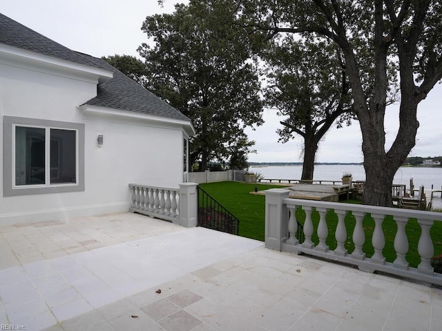 view of patio with a water view