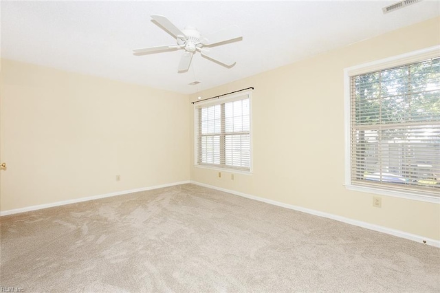 carpeted empty room with ceiling fan