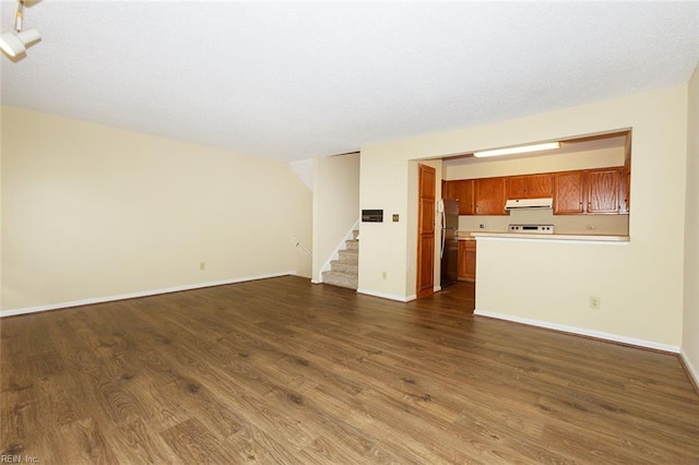 unfurnished living room with dark hardwood / wood-style floors