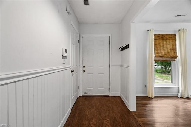 corridor featuring dark wood-type flooring