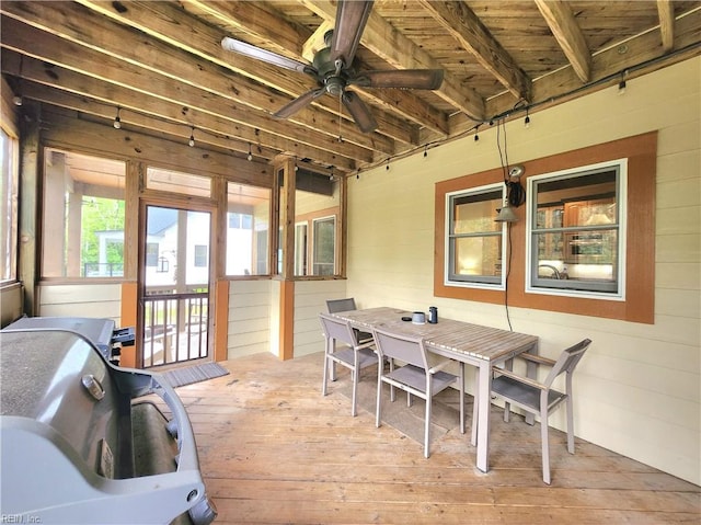 sunroom featuring wood ceiling and ceiling fan