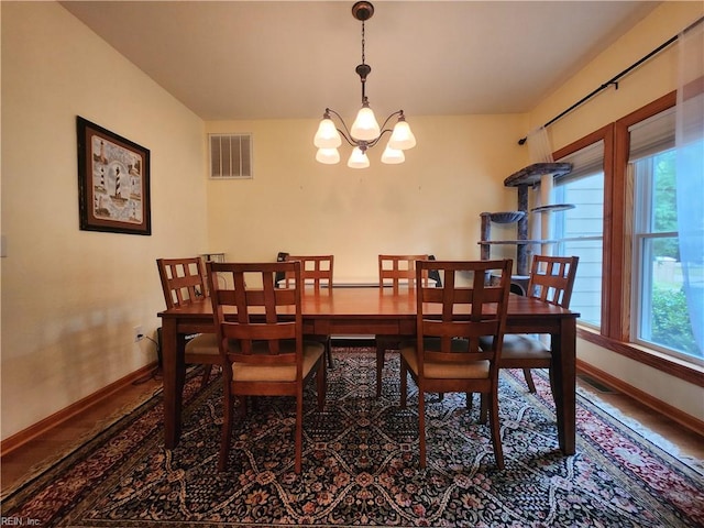 dining space featuring an inviting chandelier