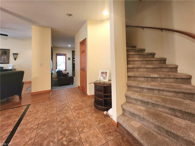 stairway featuring tile patterned floors