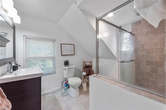 bathroom with vaulted ceiling, a shower with door, tile patterned floors, vanity, and toilet