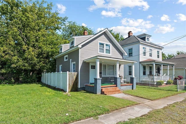 view of front of home with a front lawn and covered porch