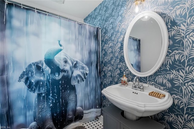 bathroom featuring vanity, walk in shower, and tile patterned floors