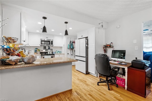 kitchen with white cabinetry, kitchen peninsula, hanging light fixtures, light hardwood / wood-style flooring, and stainless steel appliances