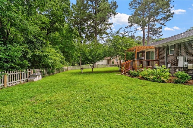 view of yard featuring a pergola and a deck