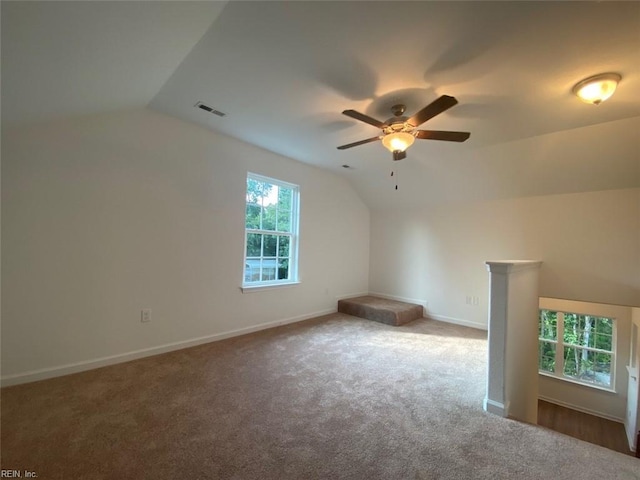 bonus room with lofted ceiling, carpet flooring, and ceiling fan