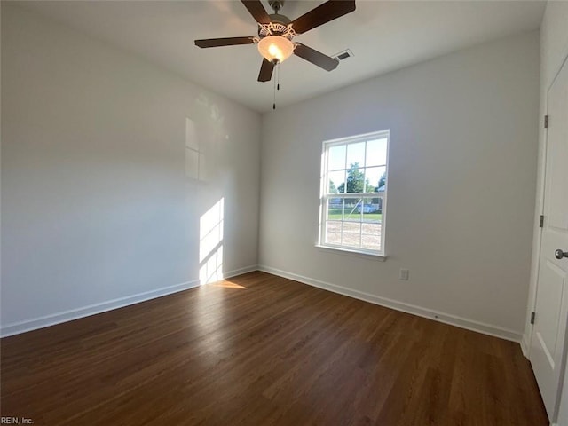 unfurnished room featuring dark hardwood / wood-style flooring and ceiling fan