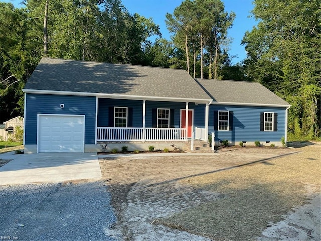 single story home featuring a porch and a garage