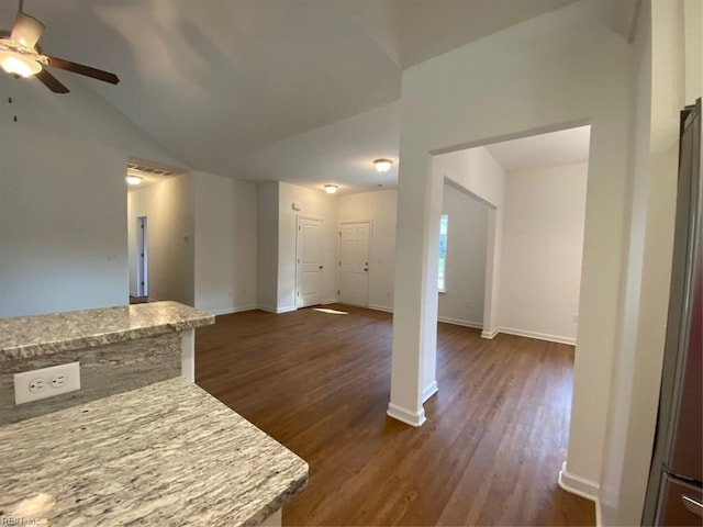 unfurnished living room with vaulted ceiling, dark hardwood / wood-style flooring, and ceiling fan