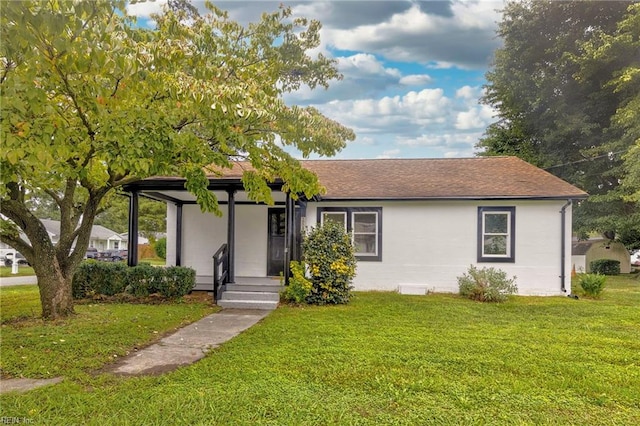 ranch-style house with a front lawn