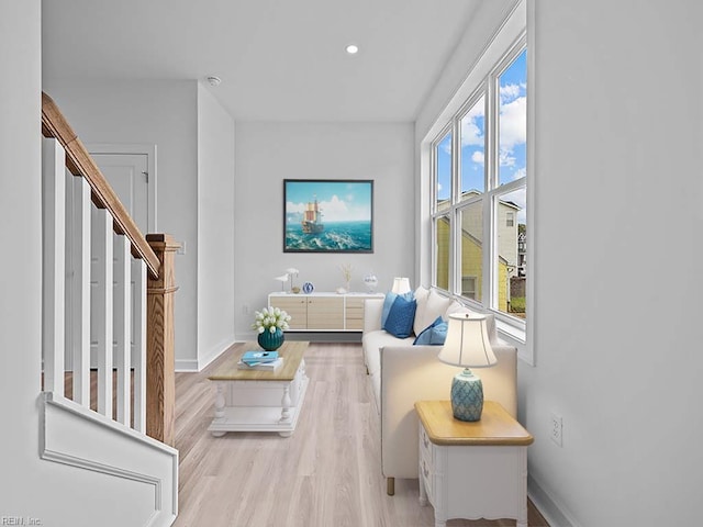 living room with light hardwood / wood-style flooring and a wealth of natural light