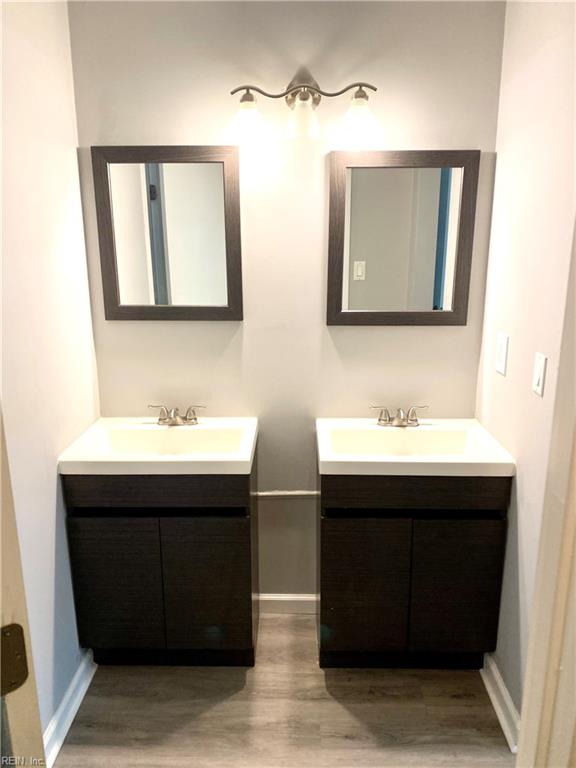 bathroom featuring hardwood / wood-style flooring and vanity