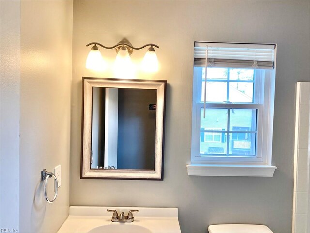 bathroom featuring vanity and toilet