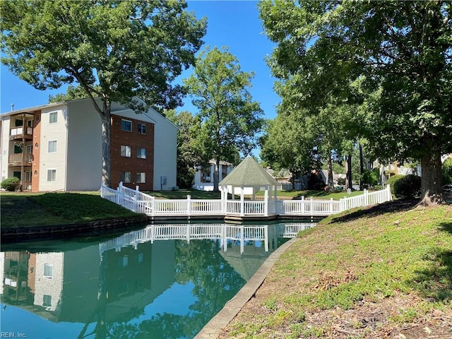 view of swimming pool featuring a lawn and a gazebo