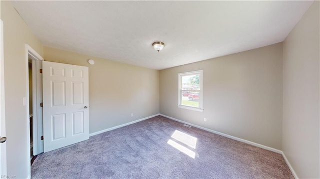 empty room featuring carpet