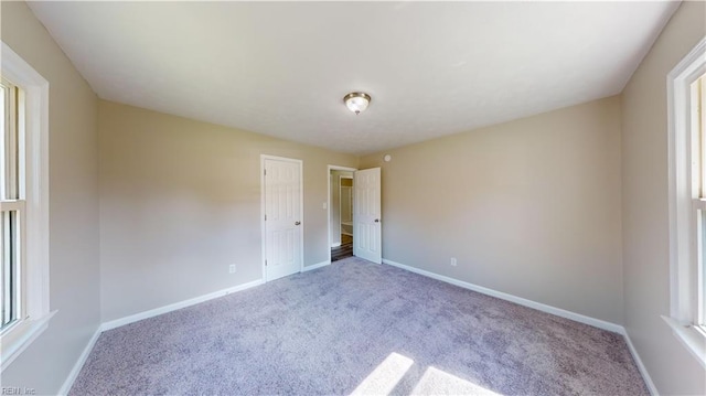 unfurnished bedroom featuring carpet