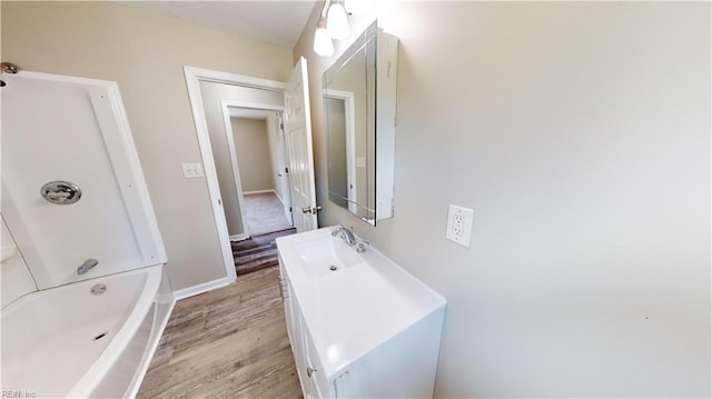 bathroom with hardwood / wood-style flooring and vanity