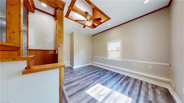 interior space with vaulted ceiling, ceiling fan, hardwood / wood-style flooring, and crown molding