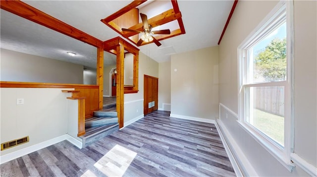 spare room with hardwood / wood-style floors and ceiling fan