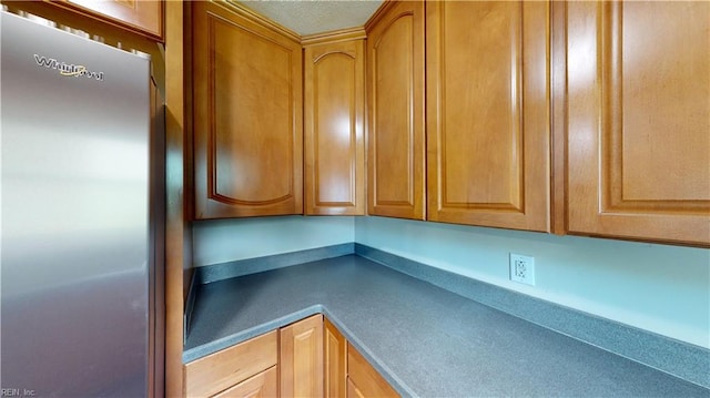 kitchen featuring stainless steel fridge