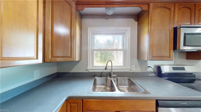 kitchen featuring appliances with stainless steel finishes and sink