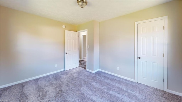 unfurnished bedroom with carpet flooring