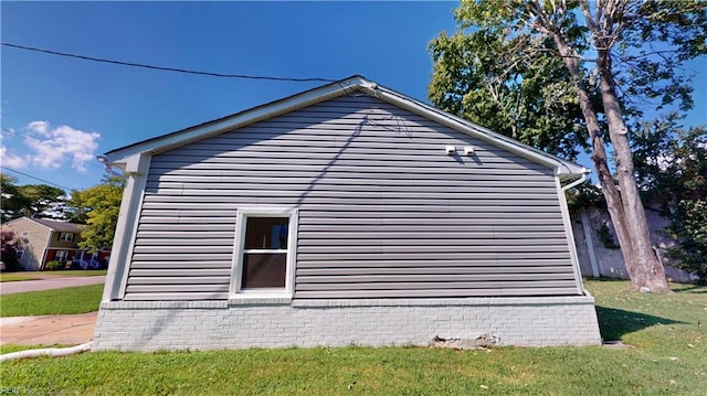 view of home's exterior featuring a yard