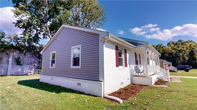 view of home's exterior with a yard