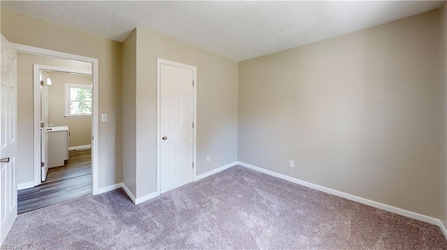 unfurnished bedroom with carpet flooring