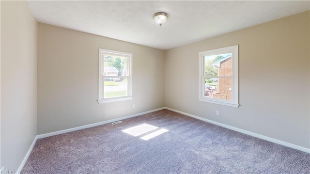 spare room with carpet flooring