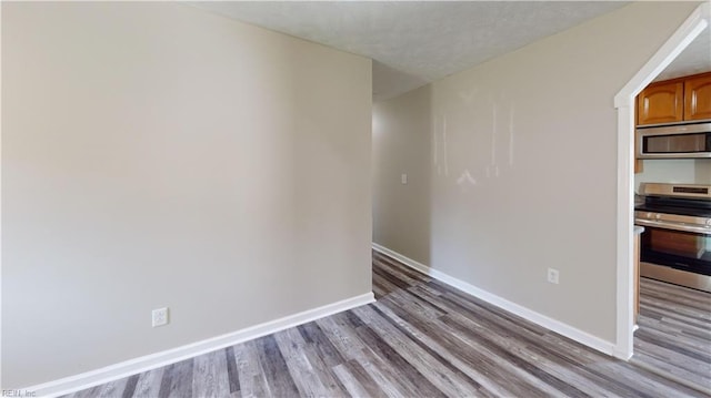 spare room featuring light hardwood / wood-style floors