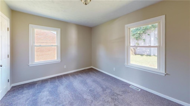 unfurnished room with carpet flooring