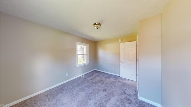 empty room with carpet floors